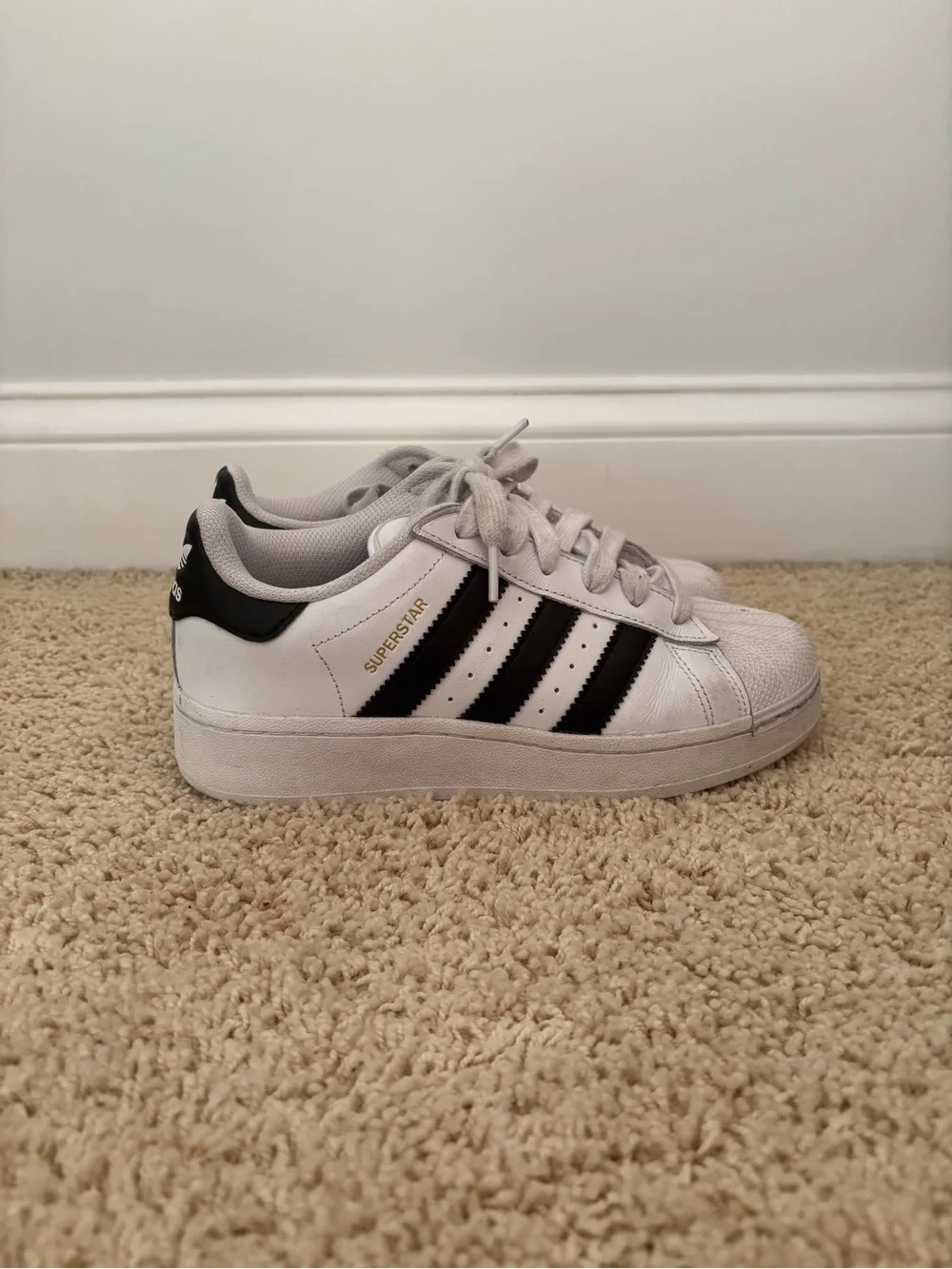 White Adidas Superstars